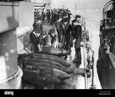 A Group Of Sailors Onboard A World War One Battleship Prepare Shells