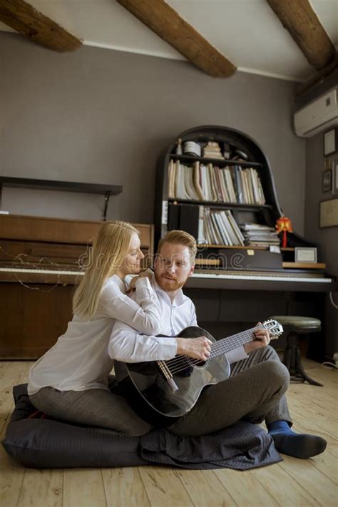 Man Playing Acoustic Guitar For His Young Beautiful Woman Stock Image Image Of Happiness Girl