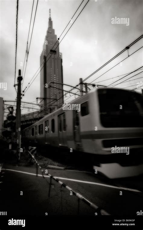 NTT DoCoMo Yoyogi Building Background And A Train In Movement On A