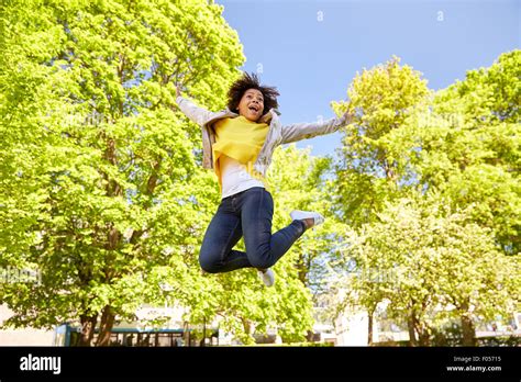 Happy African American Young Woman In Summer Park Stock Photo Alamy