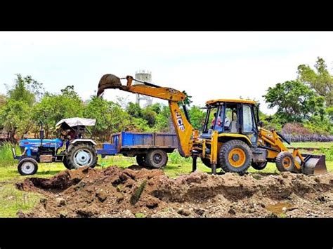 Jcb Backhoe Loader Loading Mud In Sonalika Tractor Jcb Going To