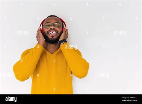 Relaxed Smiling Bearded African American Male In Sweater And Eyeglasses