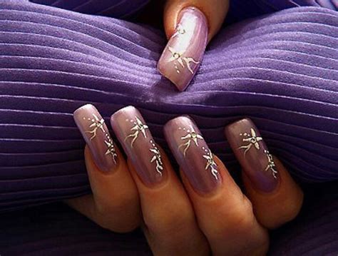 A Woman S Hands With Purple Manies And Gold Flowers On Them Holding