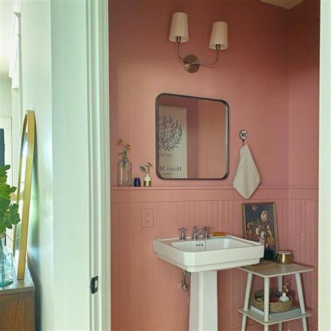 A Bathroom With Pink Walls And Flooring Is Shown In This Image From The