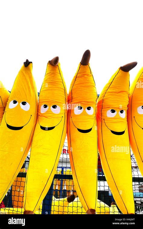 Giant Inflatable Toy Bananas With Smiley Faces On A Win A Toy Stall