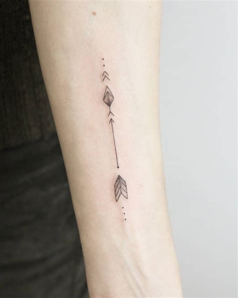 Small arrow tattoo - Tattoogrid.net