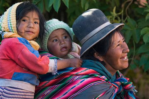 Aymara Women With Their Children. Republic Of Bolivia. Photograph by ...