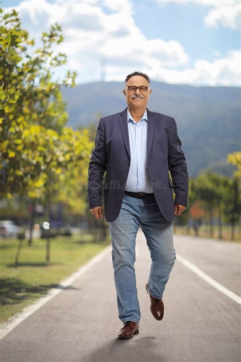 Full Length Portrait Of A Mature Man Walking Stock Photo Image Of Person Shot