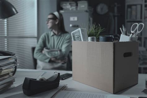 Premium Photo Pensive Woman In The Office Packing Her Belongings She