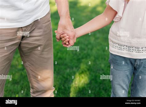 family holding hands Stock Photo - Alamy