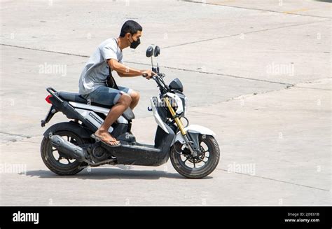 Samut Prakan Thailand Apr A Man With Face Mask Rides A