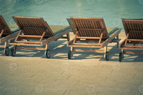 Hotel Poolside Chairs with Sea view 13082982 Stock Photo at Vecteezy