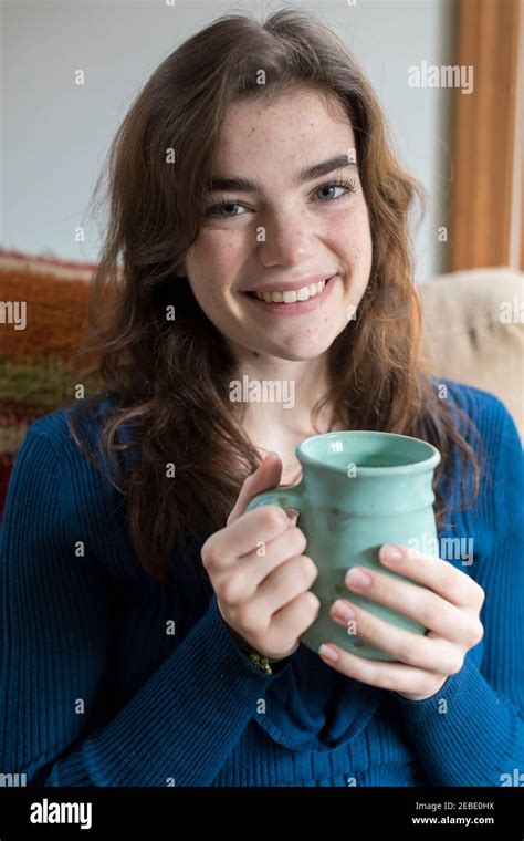 Portrait Of Seventeen Year Old Girl Smiling And Holding Coffee Cup