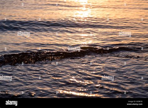 Ocean Ripples At The Sunset For Backgrounds Stock Photo Alamy