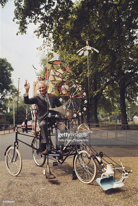 English Inventor And Cartoonist Rowland Emett Rides His New Bicycle