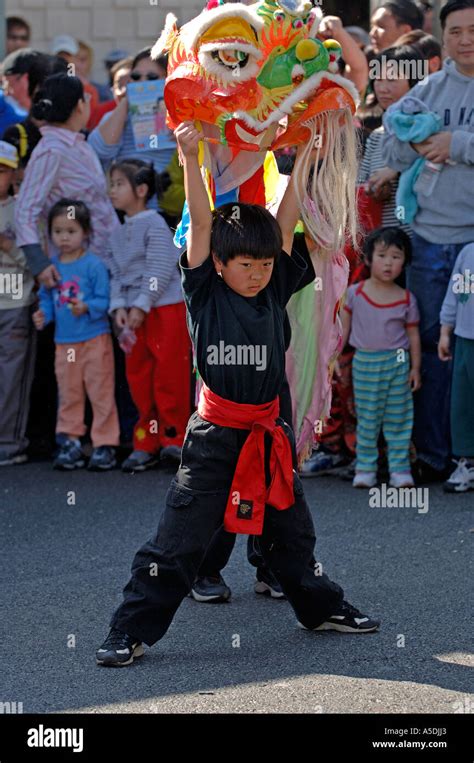 Young boy Chinese dragon dancers at the Chinese Lantern Festival ...