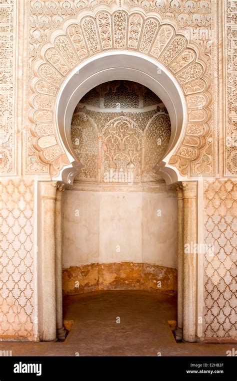 A decorative horseshoe shaped arch at the Ben Youssef Medersa in Marrakesh, Morocco, North ...