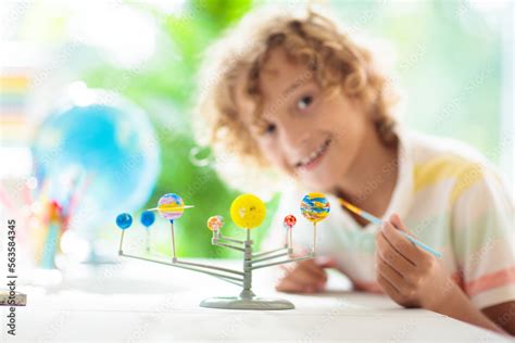 Child with solar system model. Kids planetarium. Stock Photo | Adobe Stock