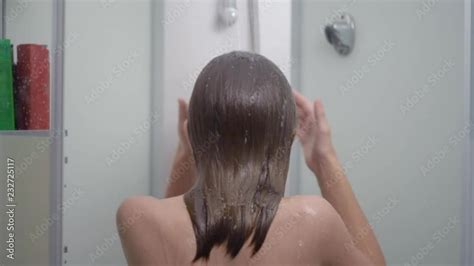 Young Girl Bathing Under A Shower At Home Back View Beautiful Teen