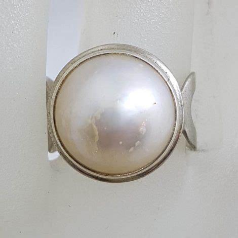 Sterling Silver Round White Mabe Pearl With Open Design Sides Ring