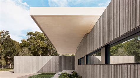 Three Cast Concrete Volumes Form Preston Hazollow House By Specht