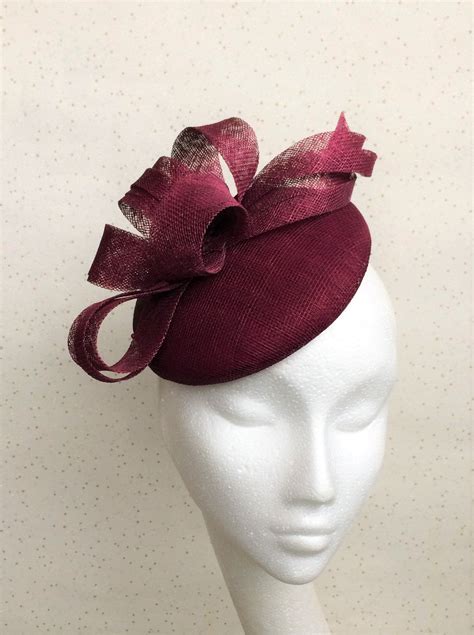 An Effortlessly Stylish Headpiece With Burgundy Looped Sinamay Detail