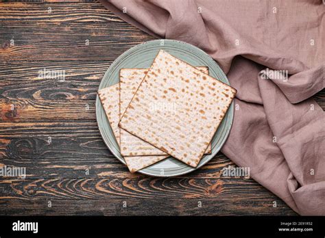 Plate With Jewish Flatbread Matza For Passover On Wooden Background