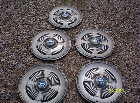 Woolcock Antique Auto Parts - Hub Cap and Wheel Discs