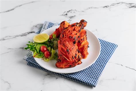 Premium Photo Indian Culture Tandoori Chicken With Lime In A Dish