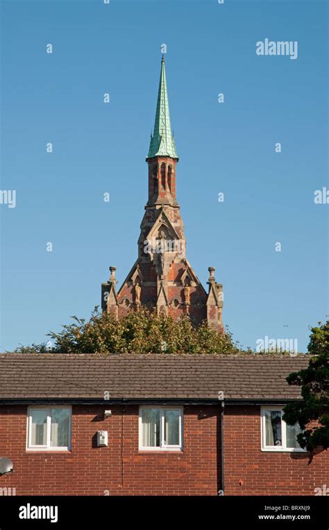 Housing In Manchester With Gorton Monastery In The Background Stock