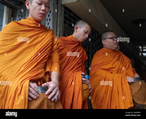 Novice monks led with their alms bowls on their customary morning alms ...