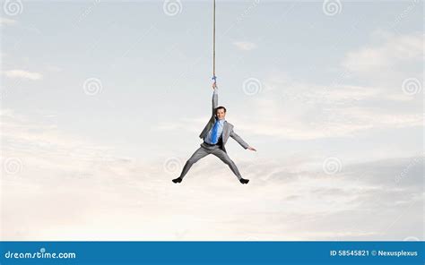 Man Hang On Rope Stock Photo Image 58545821