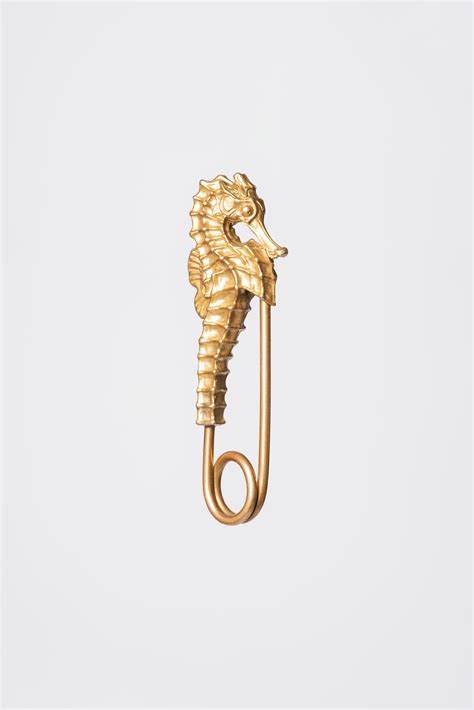 small pins  white background  stock photo