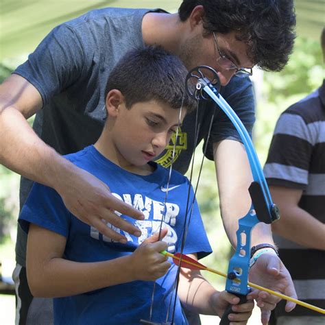 Boy Archery Instruction Ymca Of The Pines