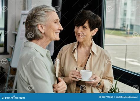 Two Mature Women A Lesbian Couple Stock Image Image Of Coworkers Colleagues