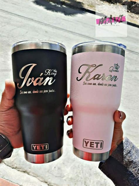 Two Women Hold Up Their Yeti Tumblers In Front Of The Camera One Is