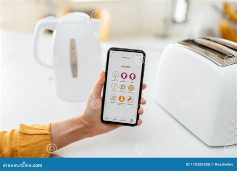 Controlling Smart Kitchen Appliance With Mobile Application Stock Photo