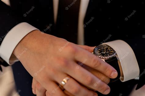 Premium Photo A Classic Watch On The Hand Of A Man In A Suit