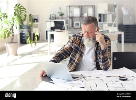 Mature Male Architect Working In Office Stock Photo Alamy