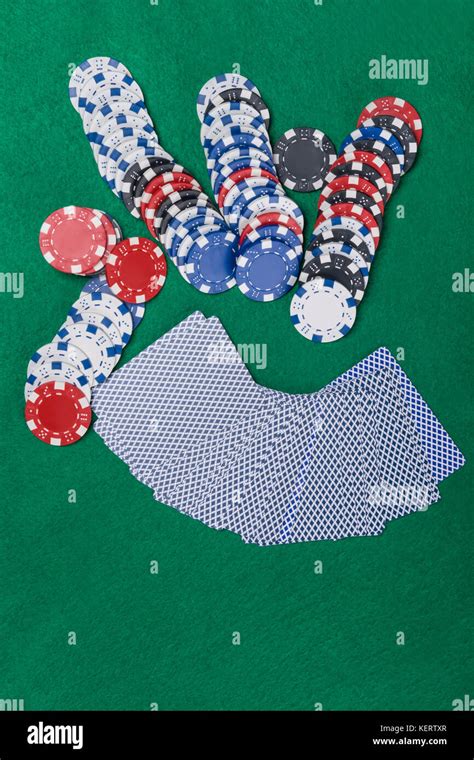 Set for poker on a green poker table Stock Photo - Alamy