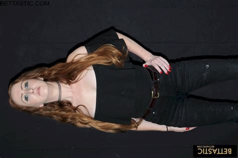 Stunning Chick Gets Naked And Poses With A Big Sword Photos