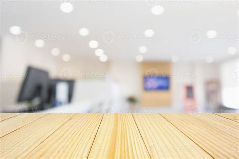 Wood Table With Abstract Blur Office Desk Workplace With Computer