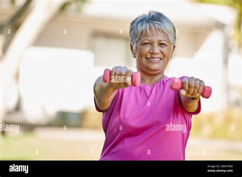 No Getting Old Here Portrait Of A Mature Woman Lifting Dumbbells