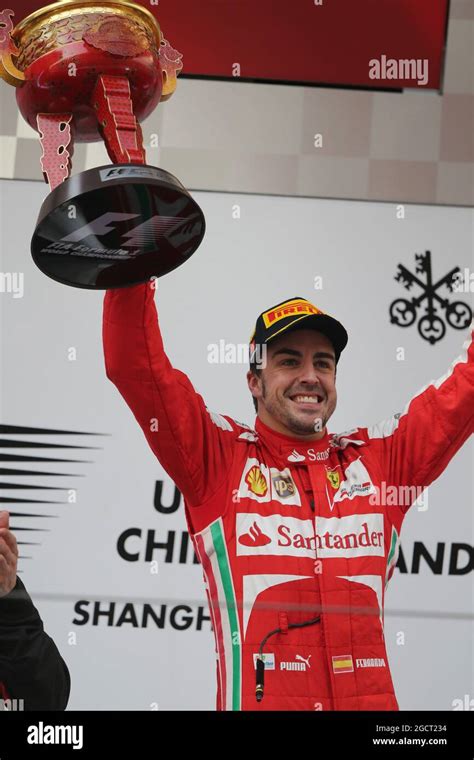 Race Winner Fernando Alonso ESP Ferrari Celebrates On The Podium