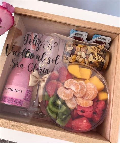 A Wooden Box Filled With Lots Of Different Types Of Fruit And Nuts Next