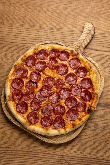 Premium Photo Tasty Pizza With Salami And Cheese