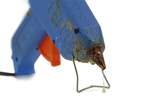 Old Used Hot Glue Gun With Focus On Melted Glue Dripping Out Isolated On White Background Stock