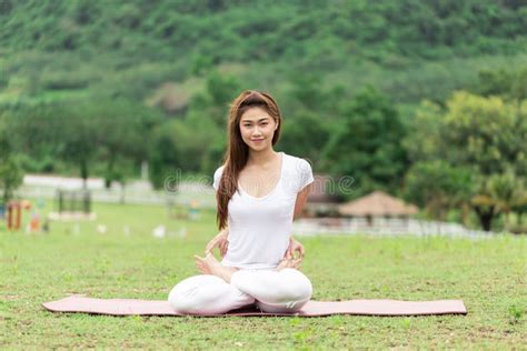 Beautiful Attractive Asian Woman Sitting On Yoga Mat Practice Baddha