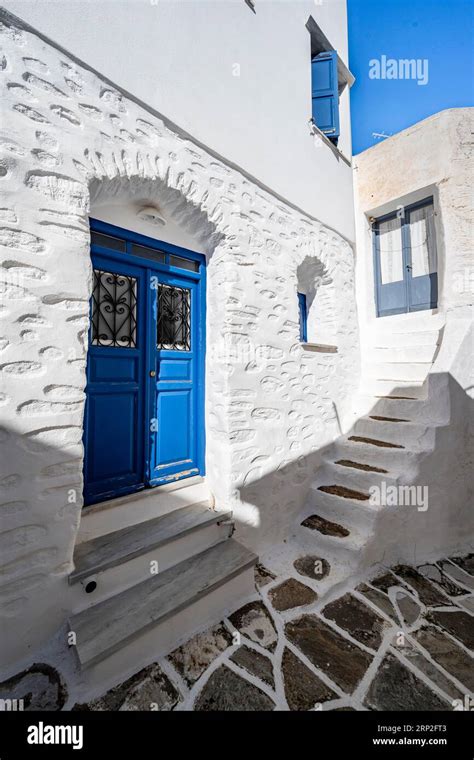 White Cycladic Houses With Blue Doors And Windows Picturesque Alleys