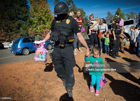 A Special Agent With The California Department Of Justice Walks A